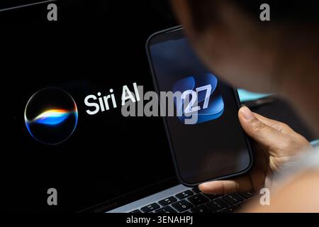 June 10, 2026: In this photo illustration, a person holds an iPhone displaying the iOS 27 logo beside a screen showing Siri AI branding on June 10, 2026, in New Delhi, India. (Credit Image: © David Talukdar/ZUMA Press Wire) EDITORIAL USAGE ONLY! Not for Commercial USAGE! Stock Photo