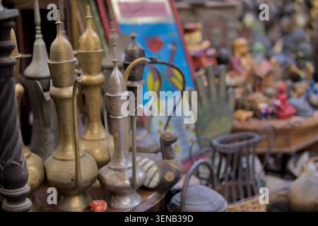 Dallah arabic coffee pots of different shapes and sizes being sold on vintage shop in Al Seef Dubai Stock Photo