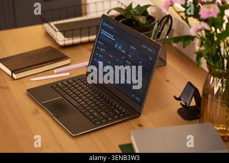 Laptop Displaying Health Monitoring Dashboard for Home Diabetes Care Stock Photo