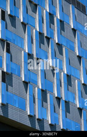 Close-up of Hennick Bridgepoint Hospital facade featuring projecting glass panels and geometric architectural design. Stock Photo