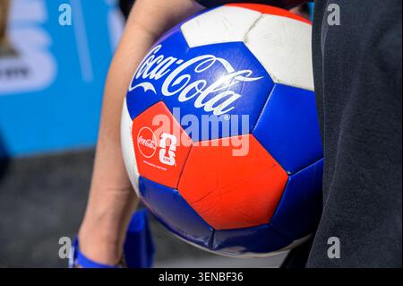 Close-up of a FIFA World Cup promotional soccer ball held by a participant at a public event. Stock Photo