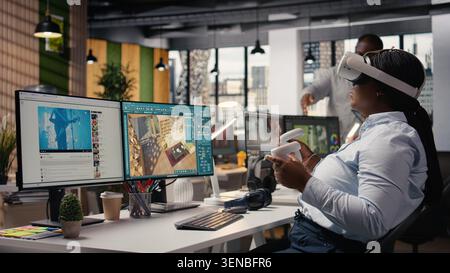 VR headset simulation, architectural floor plan, designing apartment layout and blueprint on PC with 3D modeling software. Woman employee using CAD virtual tools and VR glasses. Stock Photo