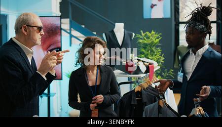 Experienced designer and sponsor of the retail store asks for elegant accessories. Stock Photo