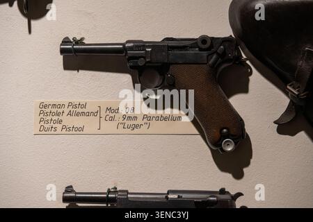 Diekirch, Luxembourg - 23 Feb 25: German Luger P08 9mm Parabellum pistol displayed with label at the Musee National d'Histoire Militaire in Diekirch, Stock Photo