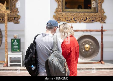Senior couple reviewing photos in smartphone together, rear view Stock Photo