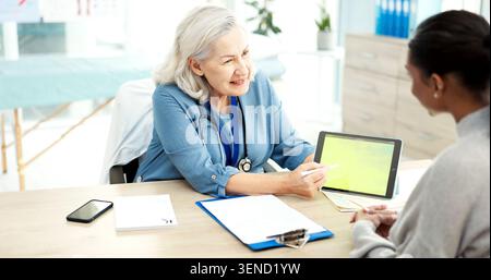 Tablet screen, consultation and doctor with woman in hospital for medical diagnosis or treatment plan. Space, digital technology and mature healthcare Stock Photo