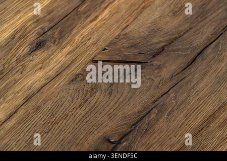 Rustic reclaimed oak wood planks texture with diagonal perspective, aged natural timber flooring background featuring authentic grain and vintage char Stock Photo