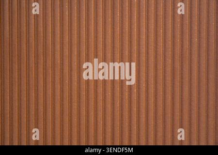 Decorative brown ceramic wall tile with vertical grooves, textured ribbed surface background for contemporary interior design, bathroom walls and arch Stock Photo