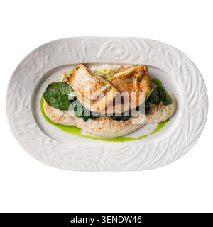 Pan seared fish on vegetable mousse Stock Photo
