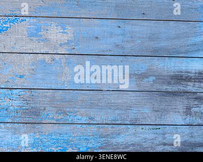 Blue Background Texture of Antique Weathered Timber Fence with Flaking Paint and Scratches. Stock Photo