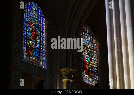 Beautiful stained glass windows illuminating the interior of Basilica de Sant Vicent Ferrer in Valencia Spain Stock Photo