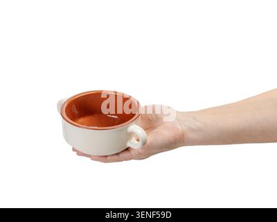Cooking bowl on the woman's palm with the white background. Stock Photo