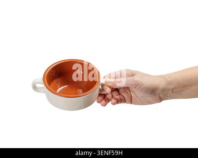 Woman's hand holding a cooking bowl on the white background. Stock Photo