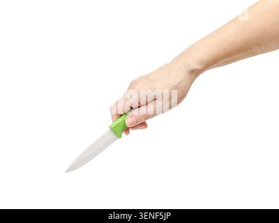 Woman's hand holding a kitchen knife on the white background. Stock Photo