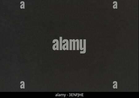 Flat black glossy paper background texture material macro close up view Stock Photo