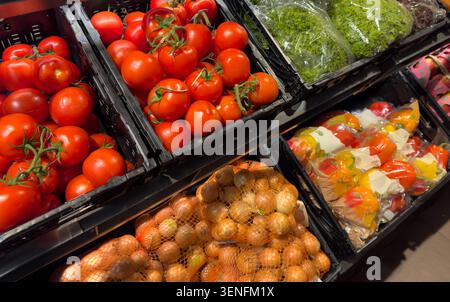 fresh organic vegetables on the shelf in the supermarket Stock Photo