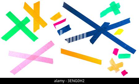 Vibrant strips of masking tape in different colors and shapes are scattered on a clean white background, highlighting their diverse visual appeal Stock Photo