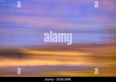 Motion Blur Abstract Landscape in Soft Purple Blue and Golden Tones Stock Photo