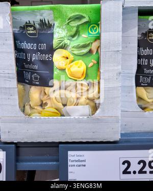 DENIA, SPAIN - January 31, 2026.A sealed packet of vegetarian tortelloni with basil, ricotta, and pine nuts is displayed on a grocery shelf in Spain. Stock Photo