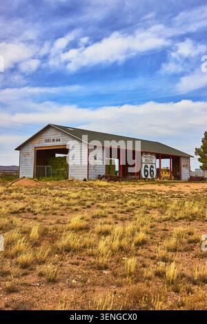 Historic Route 66 Barn Rustic Sign and Grassland in Arizona Stock Photo
