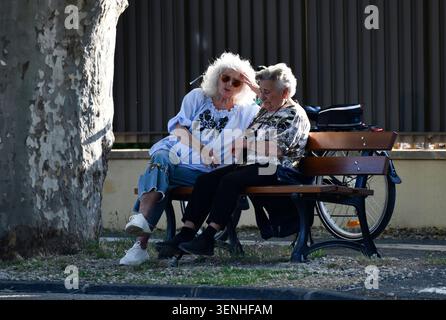 Deep in thought. Two ladies in conversation in late afternoon sunlight in Provence, France, 2026 Stock Photo
