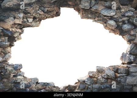 Big hole in an old historic stone wall, isolated cutout to use as a frame with white copy space Stock Photo