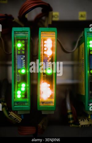 Closeup of PLC Modules Status LED Lights on Control Panel Stock Photo