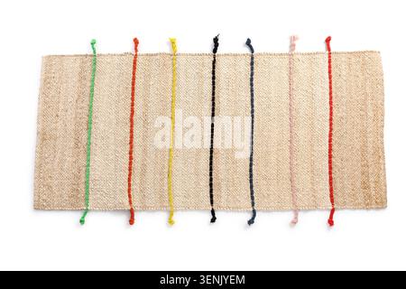 Handwoven jute rug with colorful vertical stripes, natural fiber textile for home decor and interior design Stock Photo