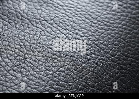 Black leather texture background with detailed grain pattern, natural material surface for design and upholstery, this abstract design is suitable for Stock Photo
