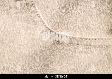 Creamy beige leather texture with stitched seam detail, fashion and upholstery material background Stock Photo