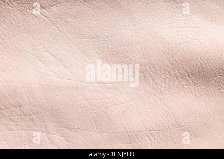 Light pink leather texture background with natural wrinkles and folds, close-up view of soft material surface, the close-up view reveals the intricate Stock Photo