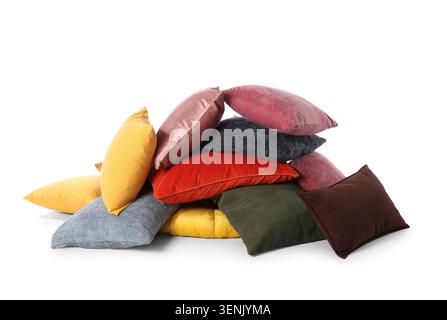 Assorted colorful decorative pillows stacked on white background, home decor and comfort Stock Photo