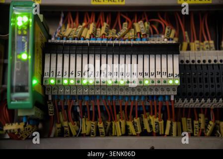 Row of Numbered Relay Modules in Electrical Control Board Stock Photo