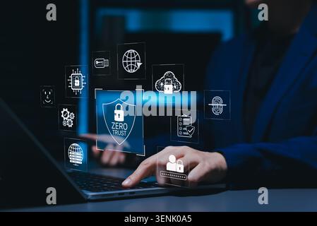 Zero trust cybersecurity and secure access protection concept. Person using laptop with virtual shield, lock, cloud, fingerprint, password, Stock Photo