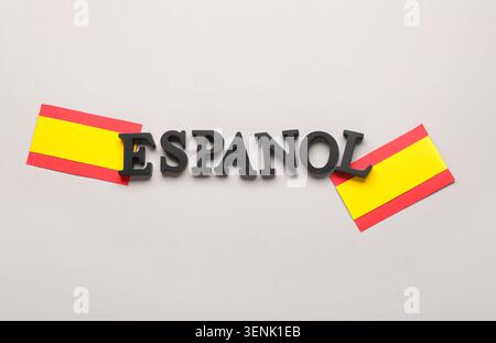 Español word with spanish flags, language learning and cultural education concept, global communication and travel Stock Photo