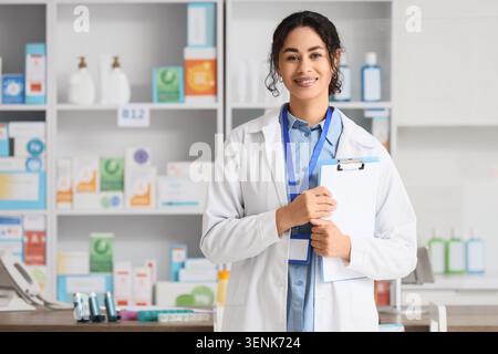 A hospital employee wears a lab coat with the words “healthcare worker ...