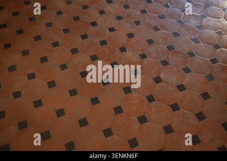 Geometric tile pattern in red and black, old terracotta floor, Medici Villa Poggio a Caiano, built from 1485 by Lorenzo il Magnifico and Giuliano de S Stock Photo