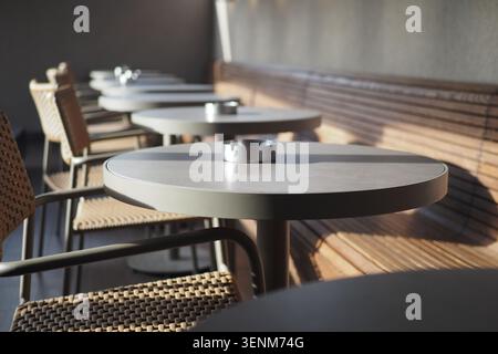 Tables and chairs in a quiet cafe during the day Stock Photo