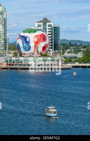 A False Creek Ferry With A FIFA Soccer Ball Atop At The Olympic Village a-false-creek-ferry-with-a-fifa-soccer-ball-atop-at-the-olympic-village