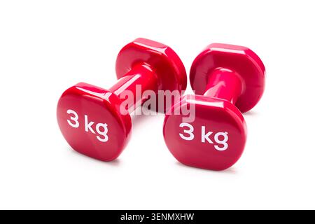 Red 3 kilogram dumbbells isolated on white background for fitness and exercise concepts Stock Photo