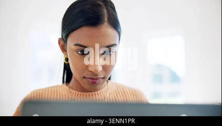 Creative, online and woman with laptop in house, video editing and freelance project on social media. Editor, post production and Indian person with Stock Photo