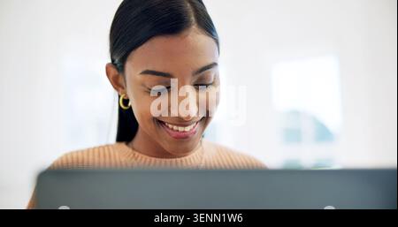 Creative, research and woman with laptop in house, video editor or freelance project on social media. Editing, online and Indian person with smile Stock Photo