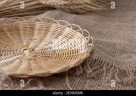 Empty Wicker Bread Tray On Rustic Burlap With Wheat Ears Stock Photo