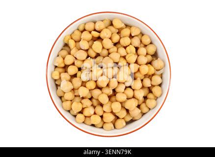 Boiled chickpeas in a ceramic bowl on white background. Top view. Stock Photo