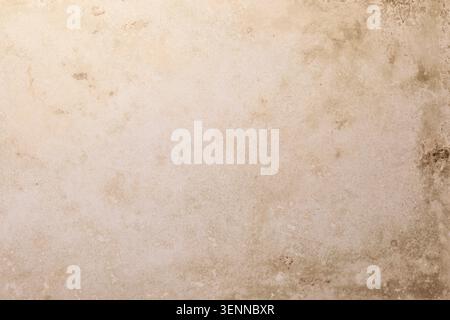 Overhead flat lay shot of a blank beige  decorative printed background. The solid textured surface features a subtle graphic or matte finish, creating Stock Photo