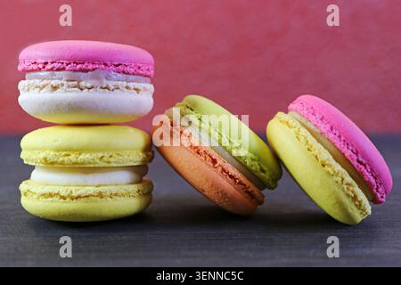 Vibrant pop art style photography featuring colorful desserts on a dark high contrast background Stock Photo