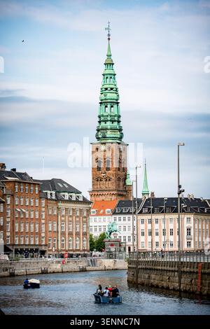 Nikolaj Kunsthal tower with green copper spire above Gammel Strand, Copenhagen, Denmark. Former St. Nicholas Church, now an art centre. Stock Photo