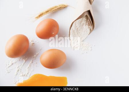 Fresh Chicken Eggs With Wheat Flour And Raw Egg Yolk For Homemade Baking Ingredients Stock Photo