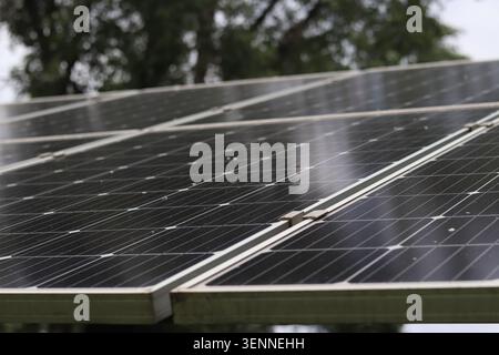 Solar panel surface with selective focus. Renewable energy concept. Modern solar panels for generating clean energy. Close-up view of photovoltaic mod Stock Photo