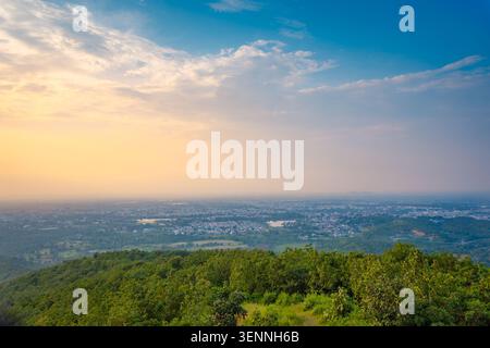 Aerial view of the cityscape of Udaipur at dusk with illuminated ...